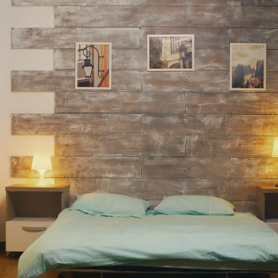 Establishing shot of stylish apartment with comfortable bed in rezidential area.