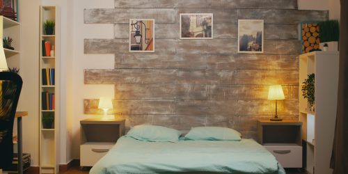 Establishing shot of stylish apartment with comfortable bed in rezidential area.